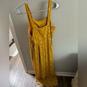 Yellow jumpsuit, super flattering, from the store Francesca’s